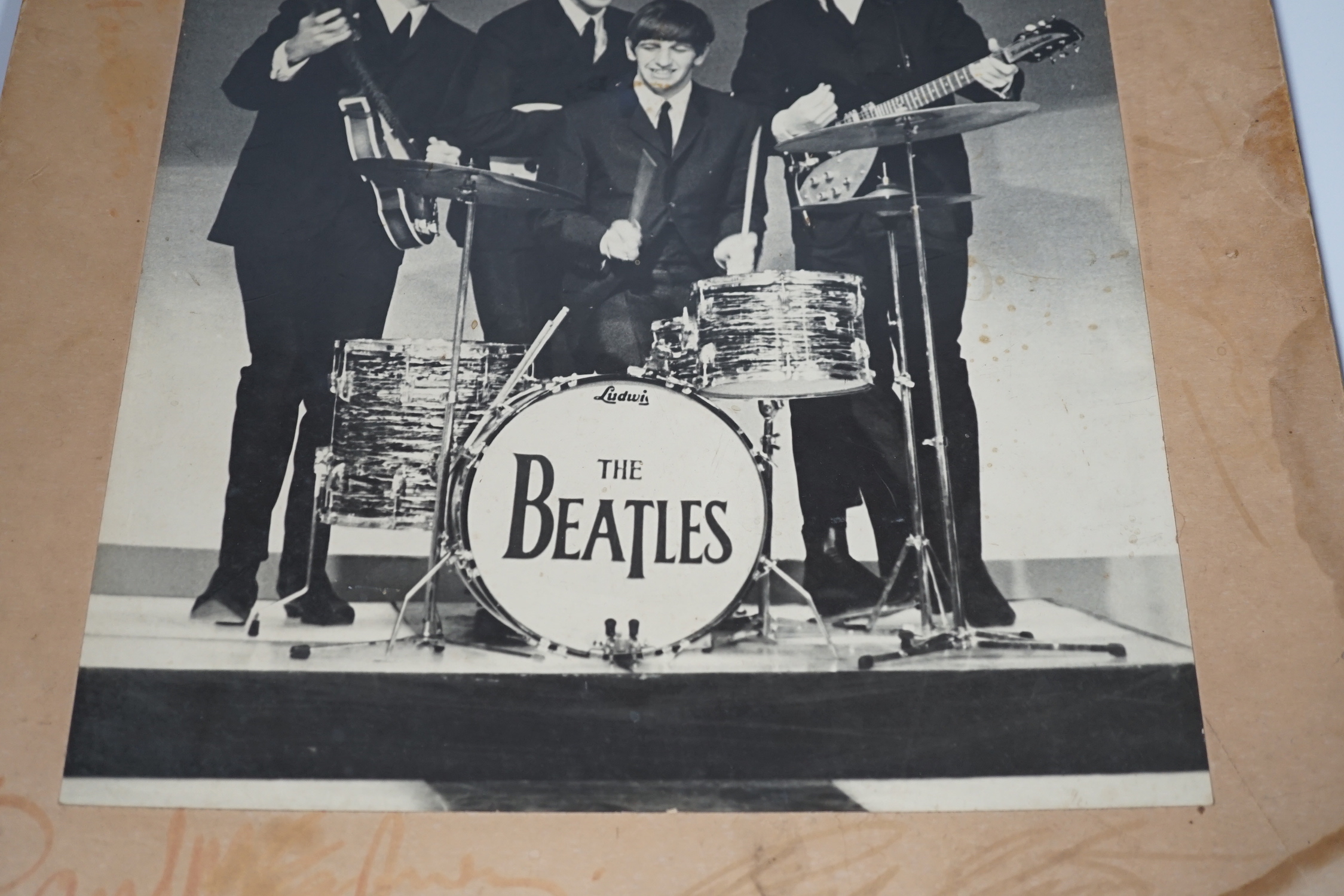 A fully signed mid-1960s The Beatles photo, signed to the original mount to which the photograph is glued